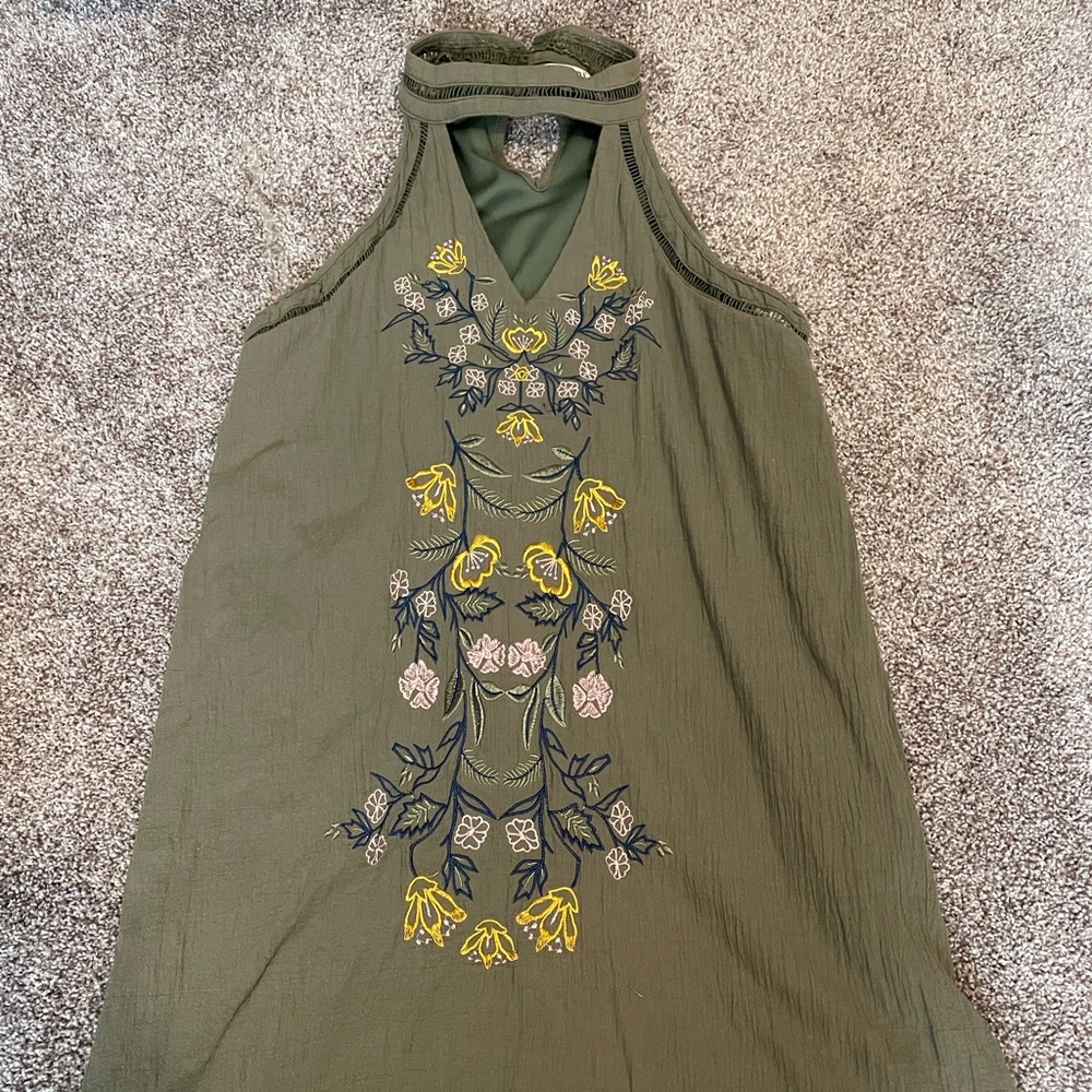 Green dress with design, size small.